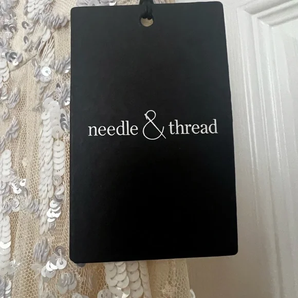 NEEDLE AND THREAD long, sequin gown.